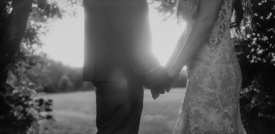 a close up view of two people holding hands