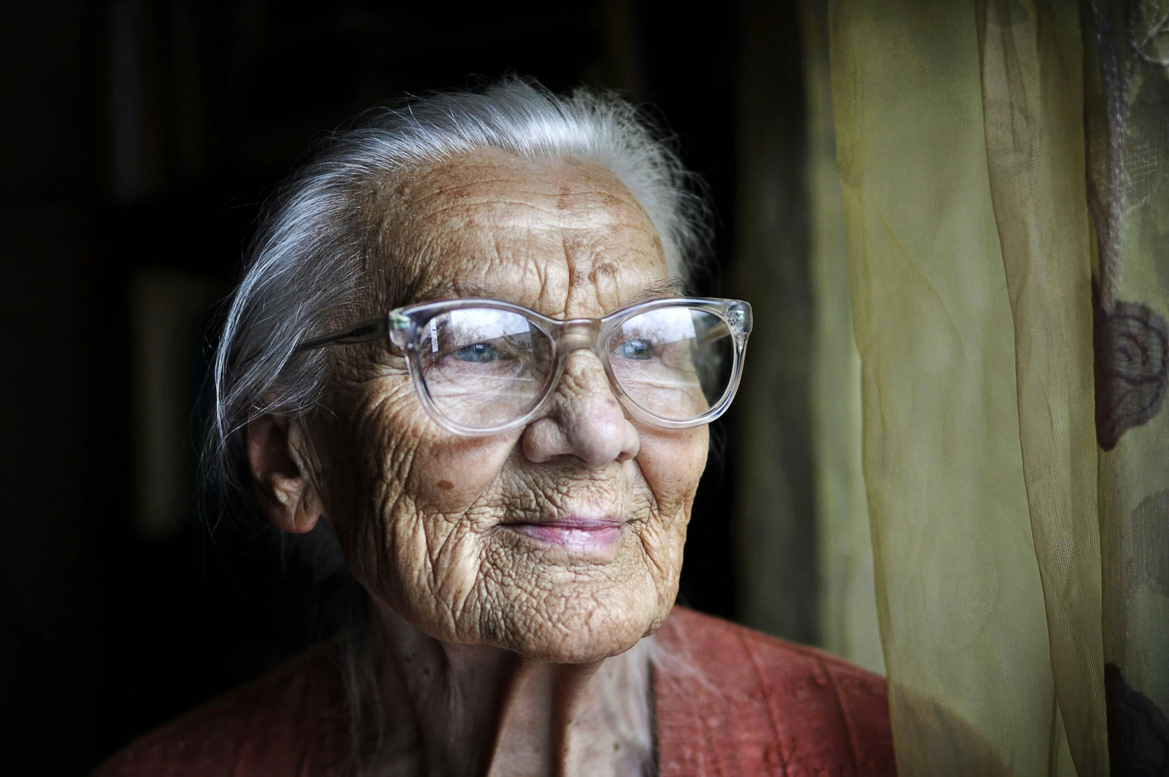 a close up of a person wearing glasses