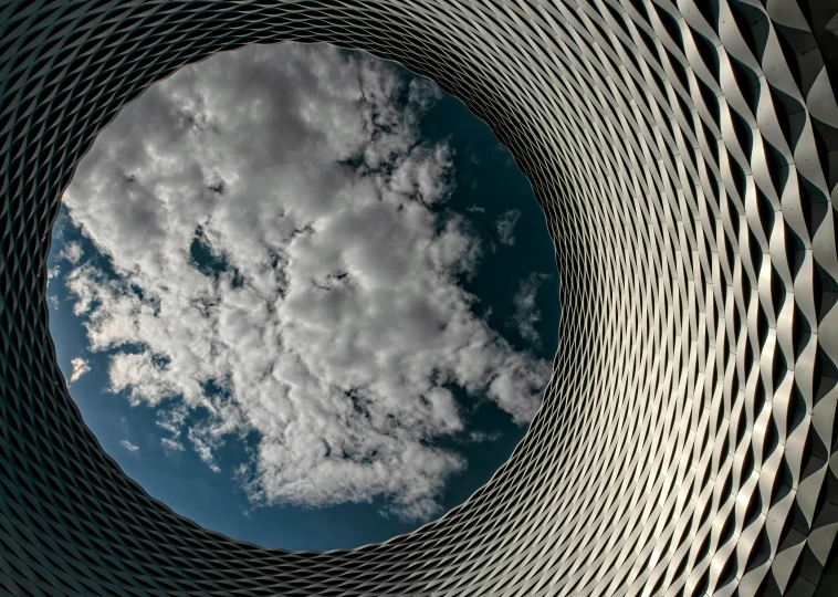 a po looking up at the sky through a circle