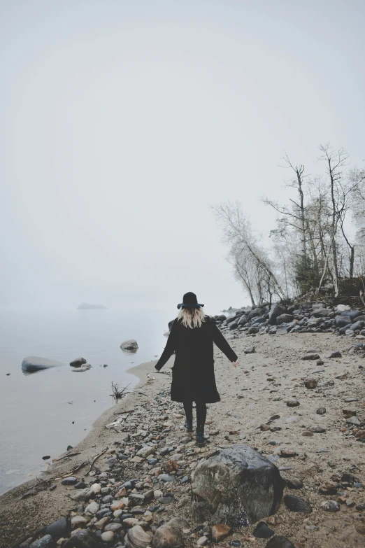 a person on the shore of a body of water