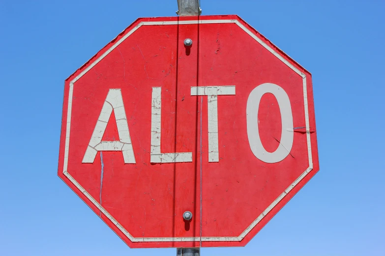 the stop sign has been vandalized with letters