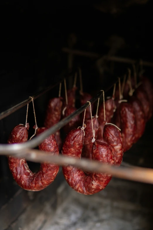 an image of many sausages being cooked on the grill
