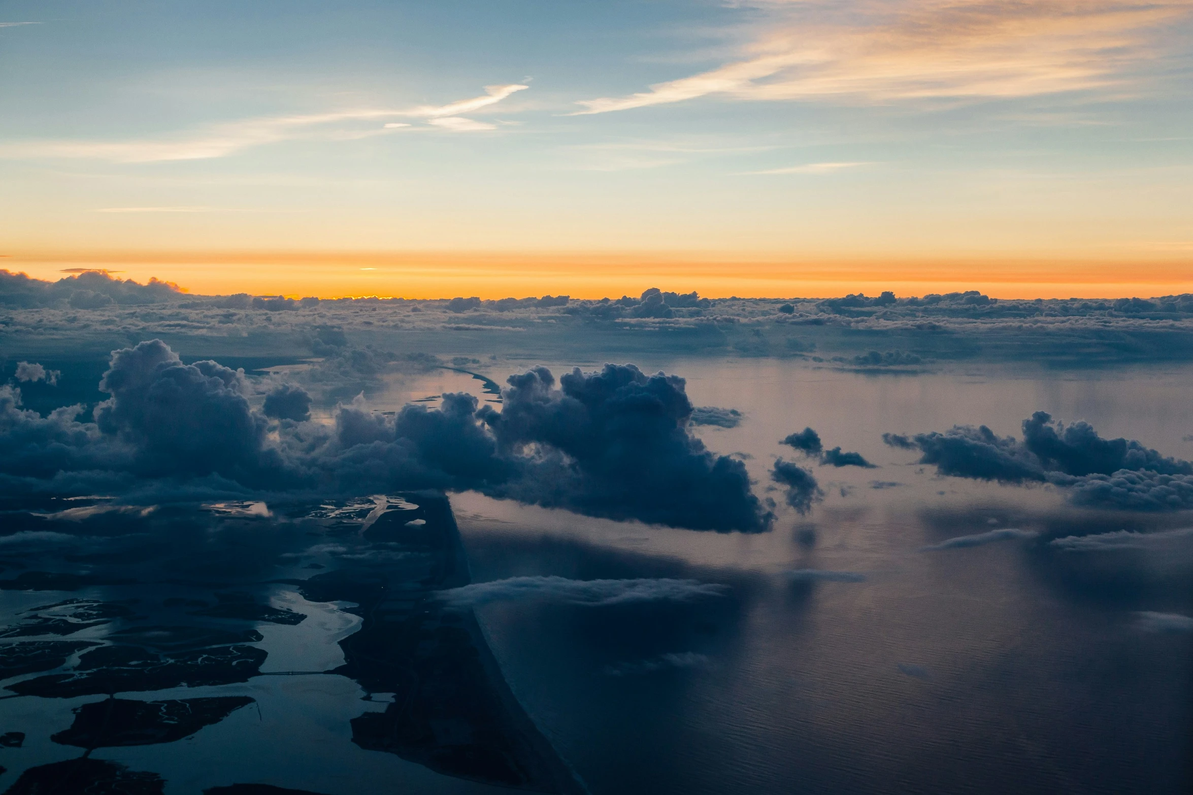 the sky, clouds and sea from above