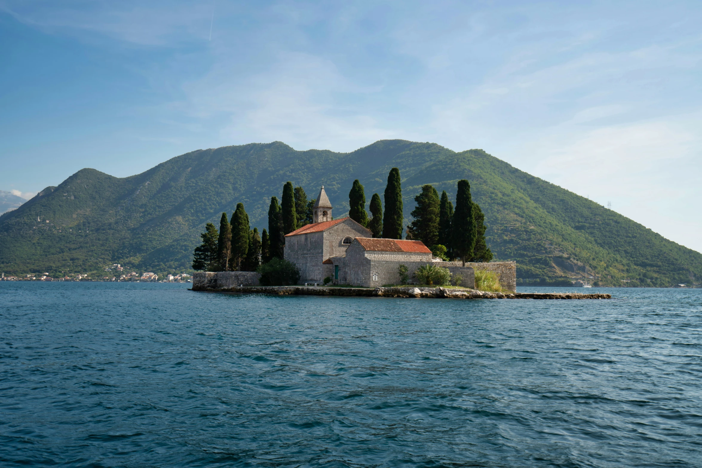 a small island with an old church built on it