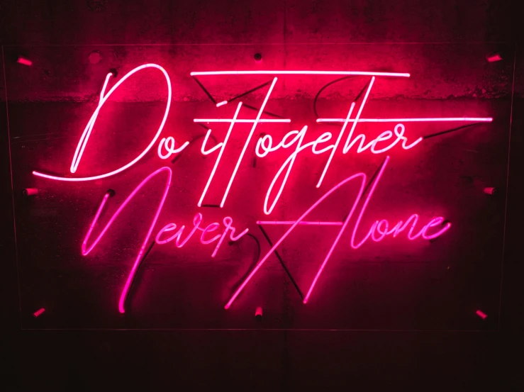 a neon sign that says, do together never alone