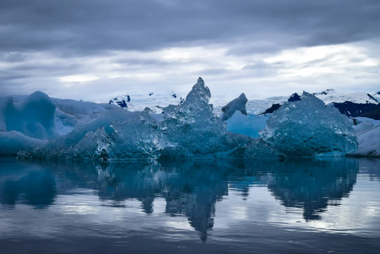 a very big icy iceberg sitting in the water