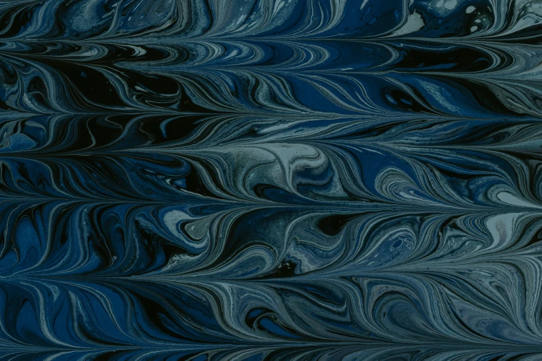 a painting that is made of blue and black swirled liquid