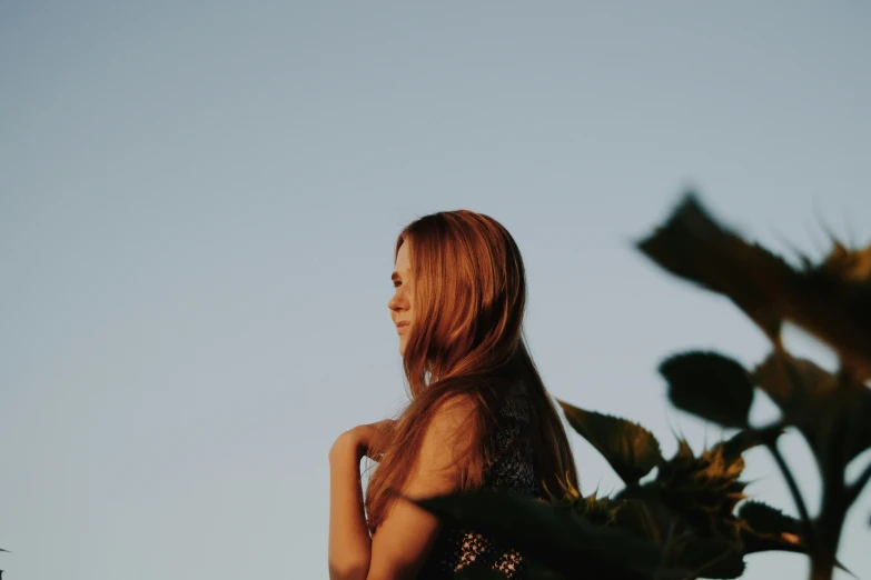 woman in back and looking up in the sky