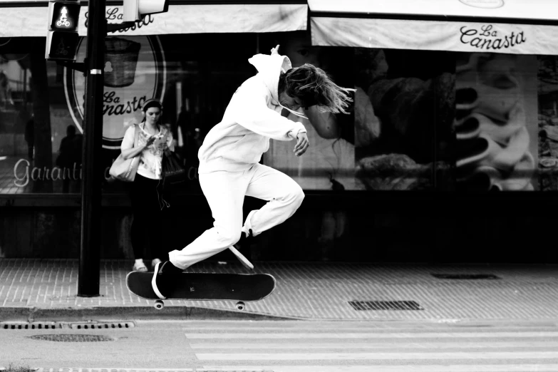 a black and white po of a boy on a skate board