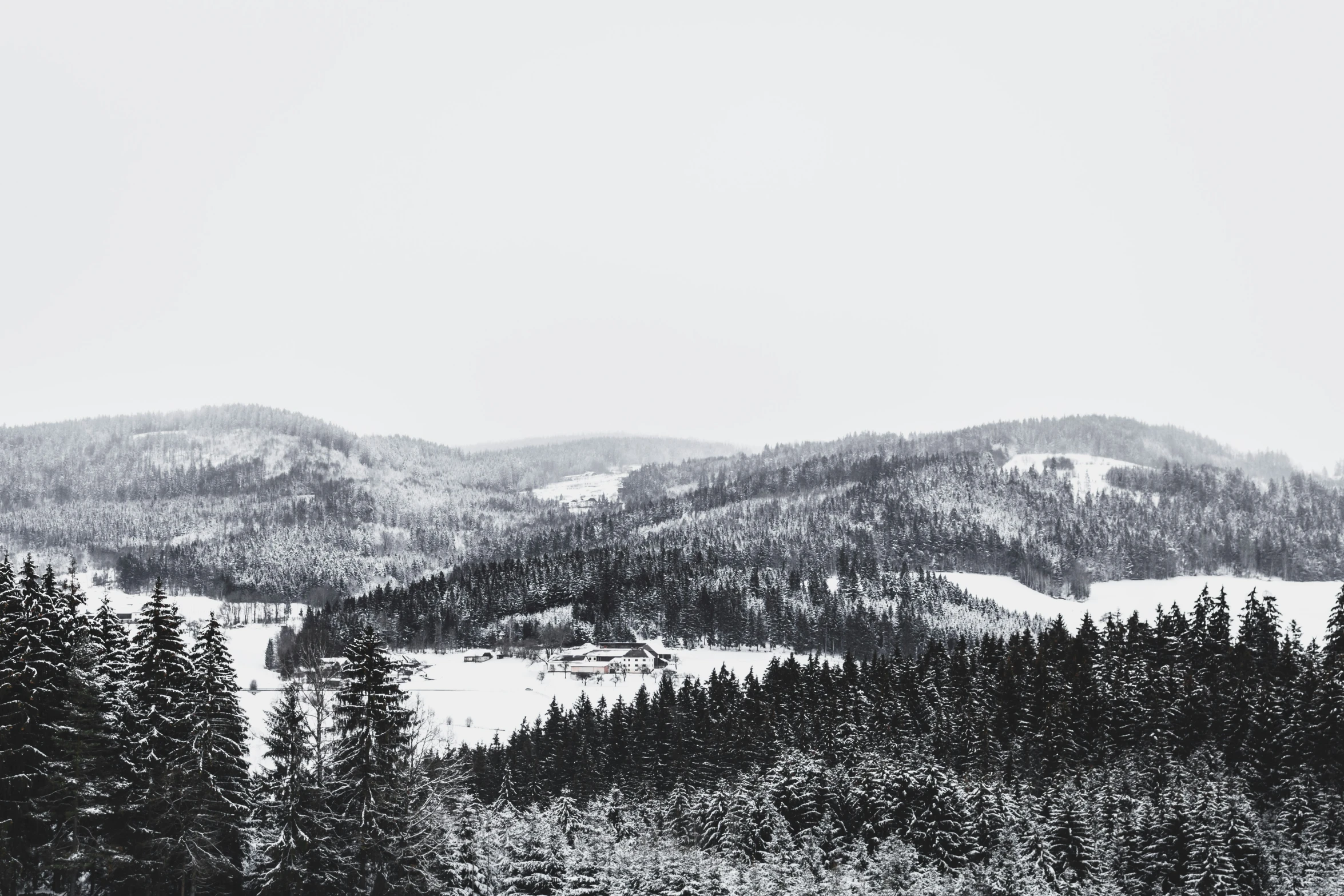 the view of snow covered mountains from above