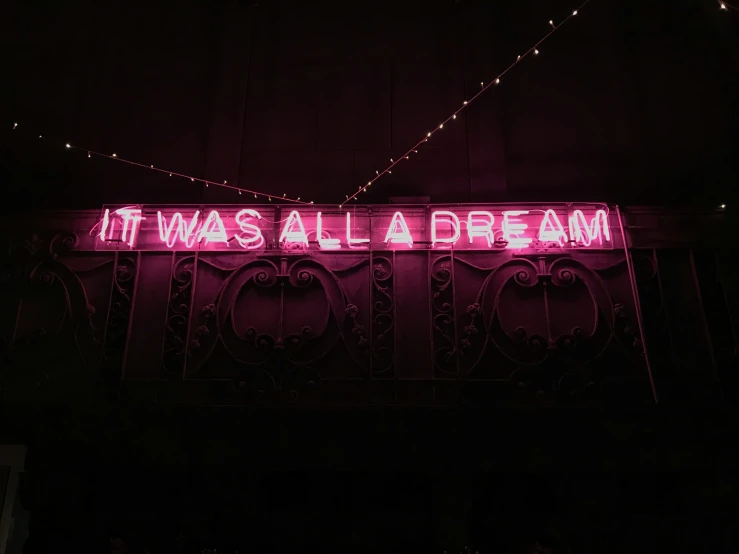 it was all a dream neon sign with strings