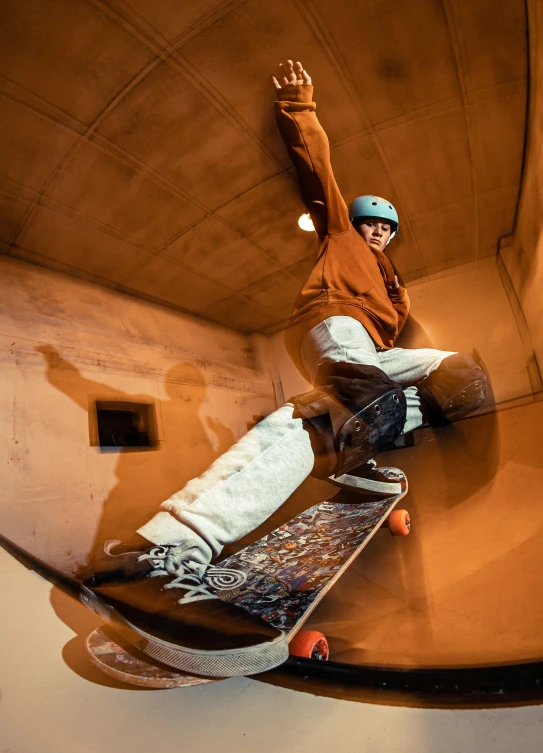 a man riding up the side of a skateboard ramp