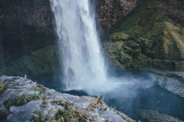 a close up of a waterfall with water coming out