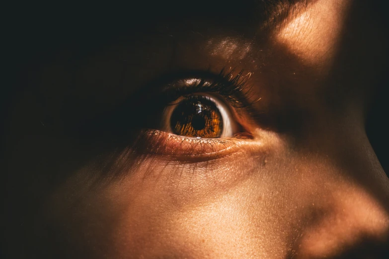 a person with their eye up is seen in this close - up po