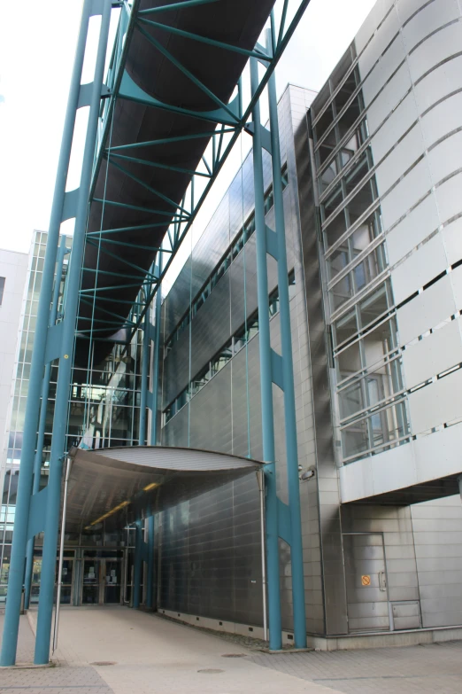 an indoor parking garage in front of a building