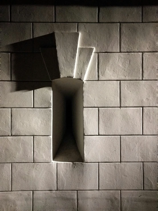 the wall is made up of blocks and paper with scissors