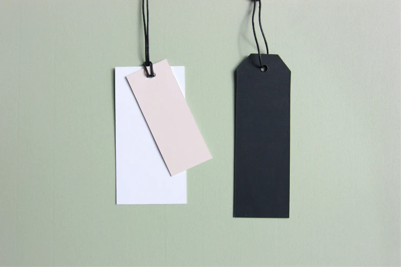 two black and white tags with white tags