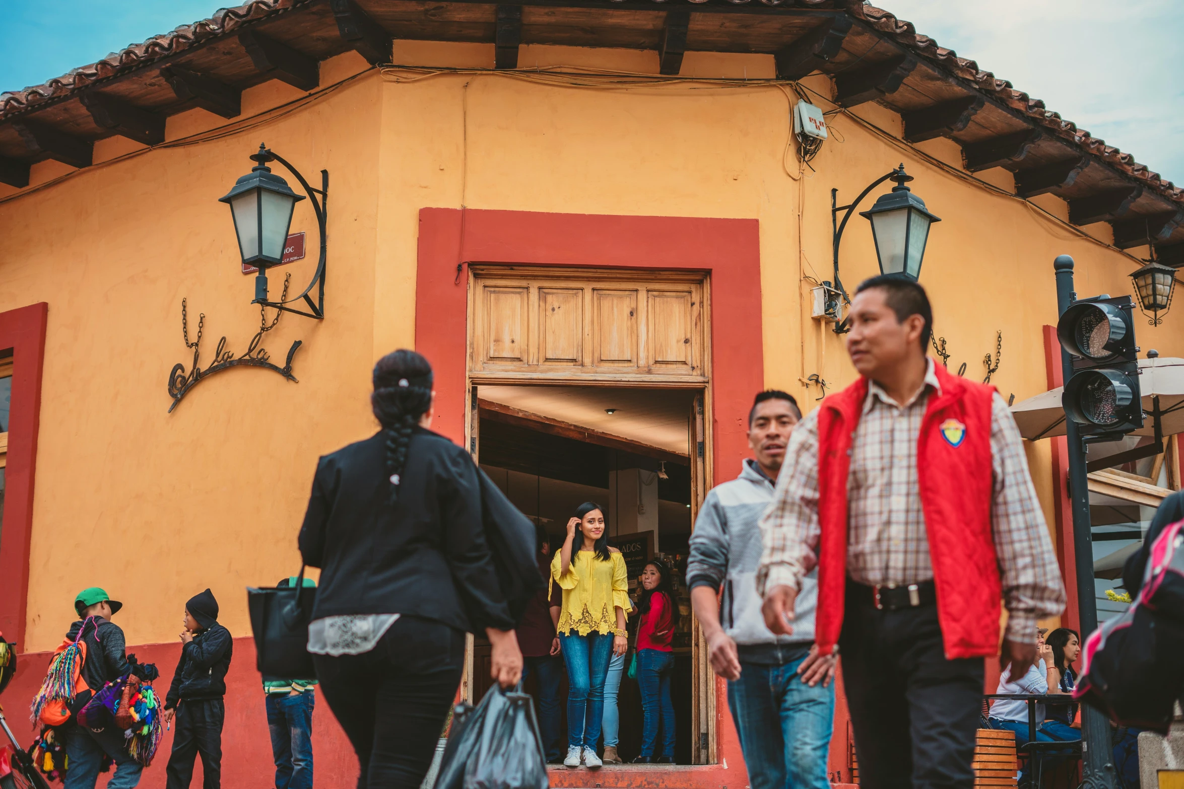 a group of people that are walking outside of a building