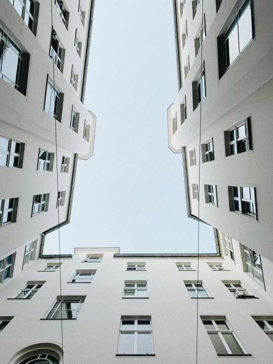 looking up at tall buildings, from below