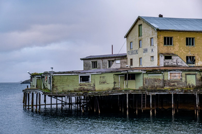 the house is perched on top of the pier