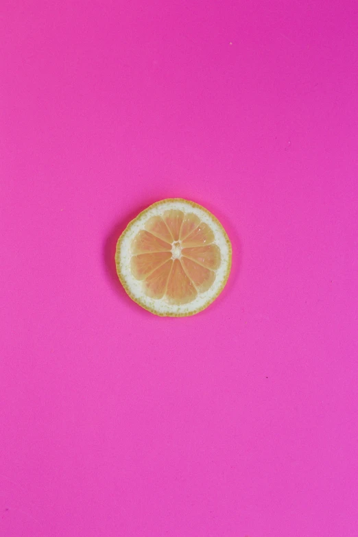 an orange is being sliced by the juicer