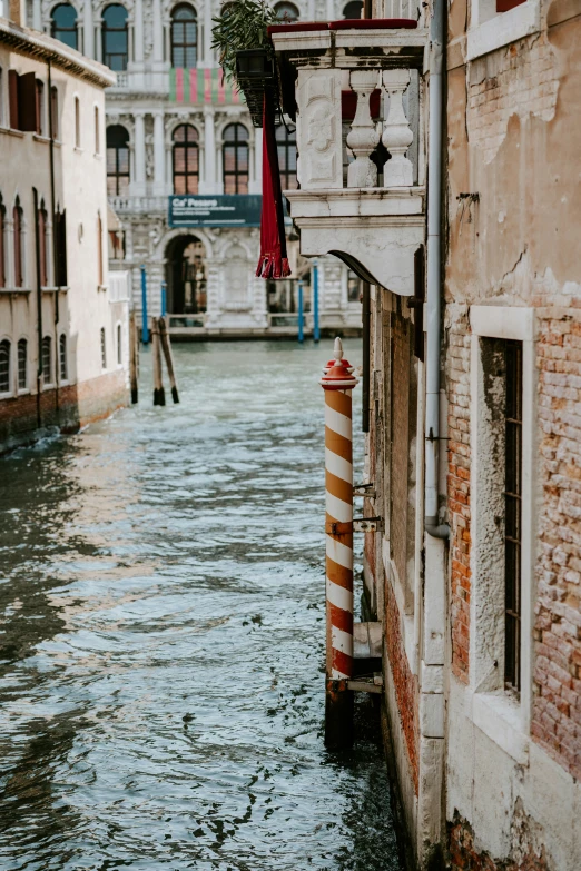 a street filled with water next to buildings