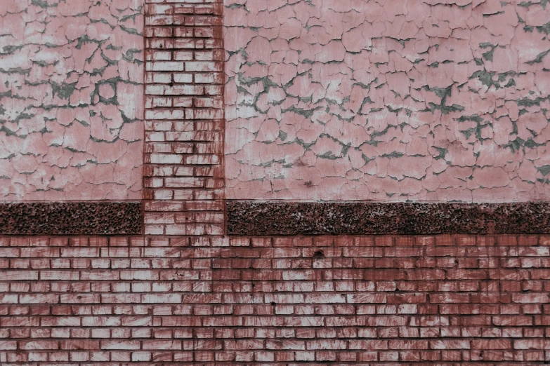 a building with a red brick design next to it