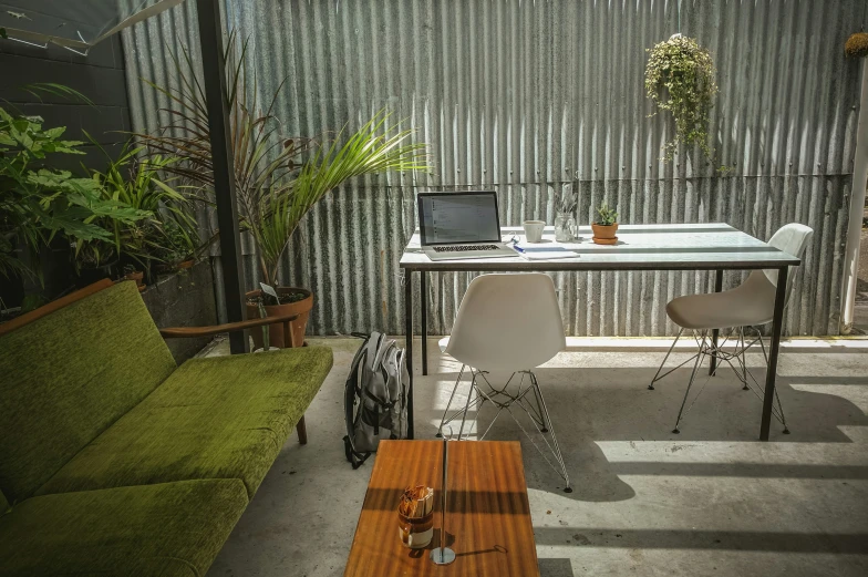 a table with a laptop sitting on it