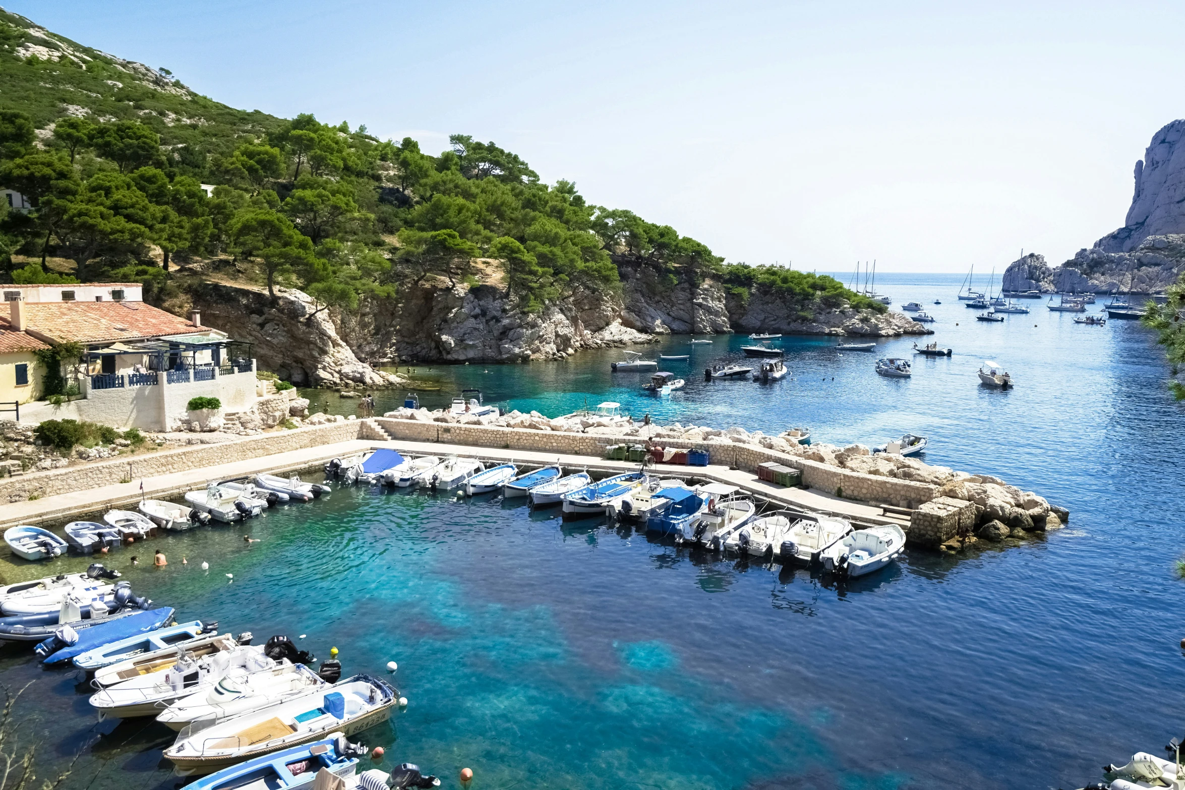 boats docked in a bay at the coast