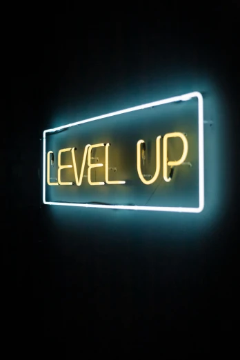 a neon sign that reads level up in front of a black background