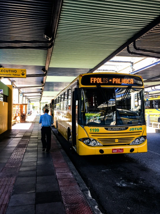 an image of people walking and a bus stop