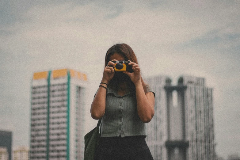 a woman taking a po with her camera