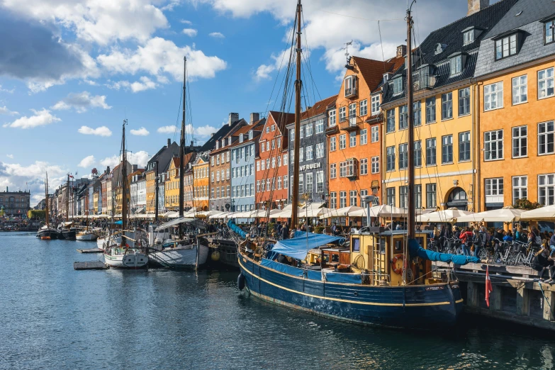 boats are parked next to buildings along the water