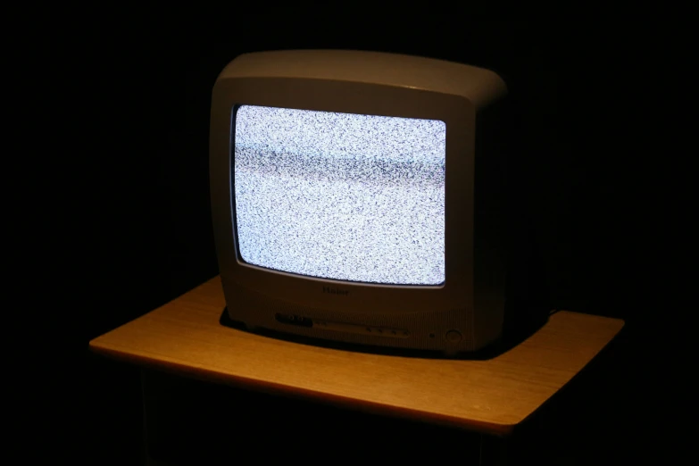 a closeup image of an old television on a stand