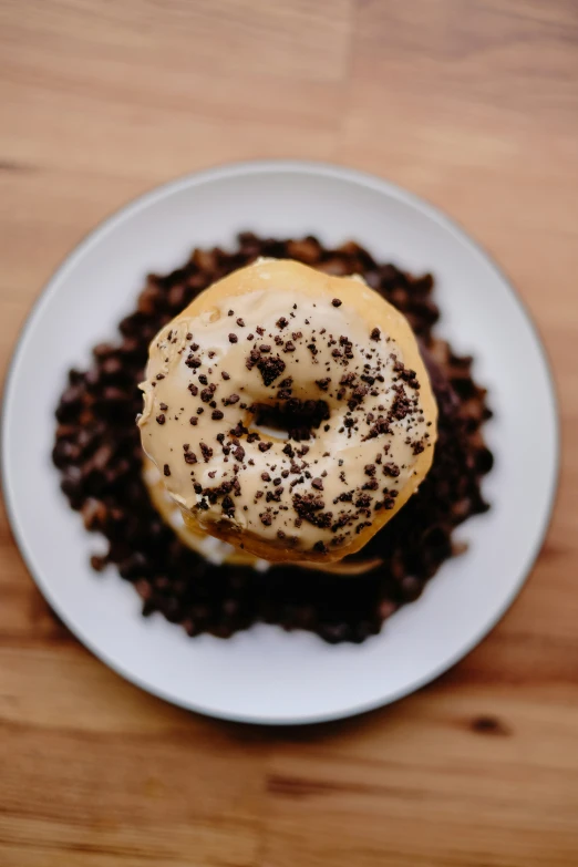 there is a white plate topped with a donut