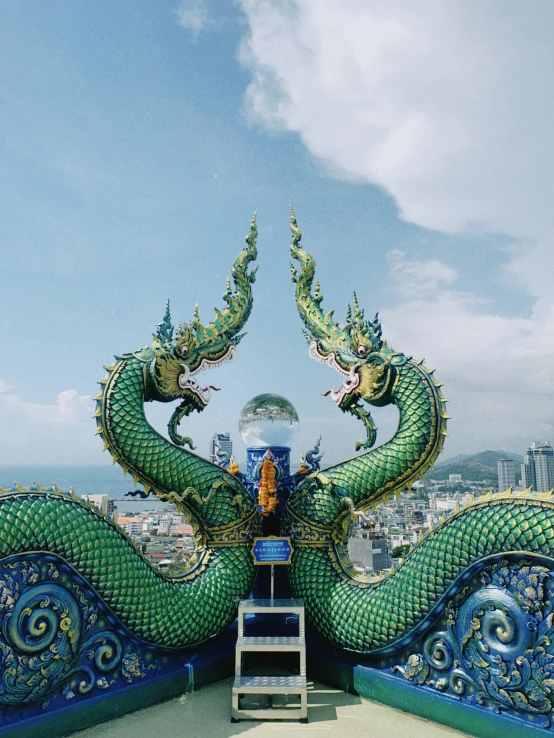 a man standing on top of a blue and green structure