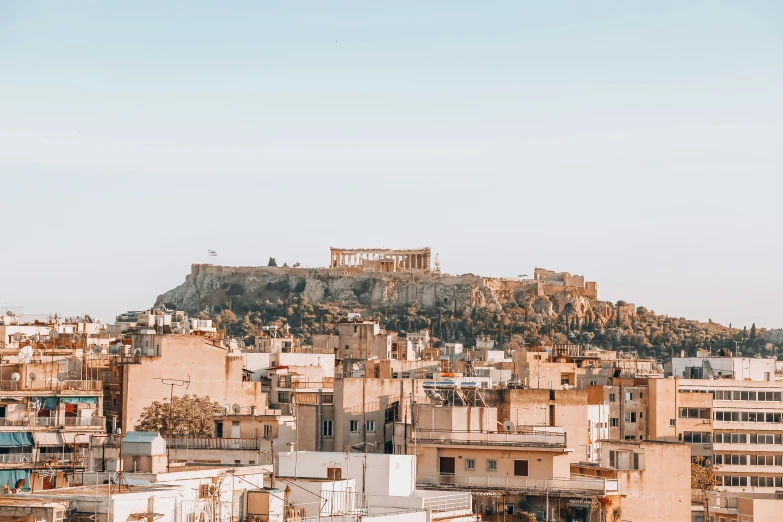 a view of buildings and a mountain range