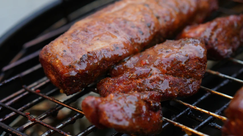 the sausage is cooking on the grill ready to be cooked