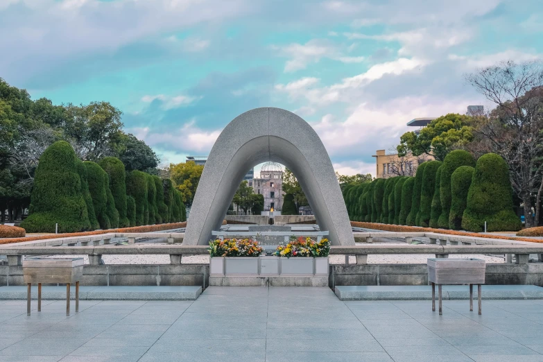 the fountain is a circular shaped piece of cement