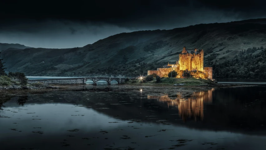 a night view of a castle by the lake