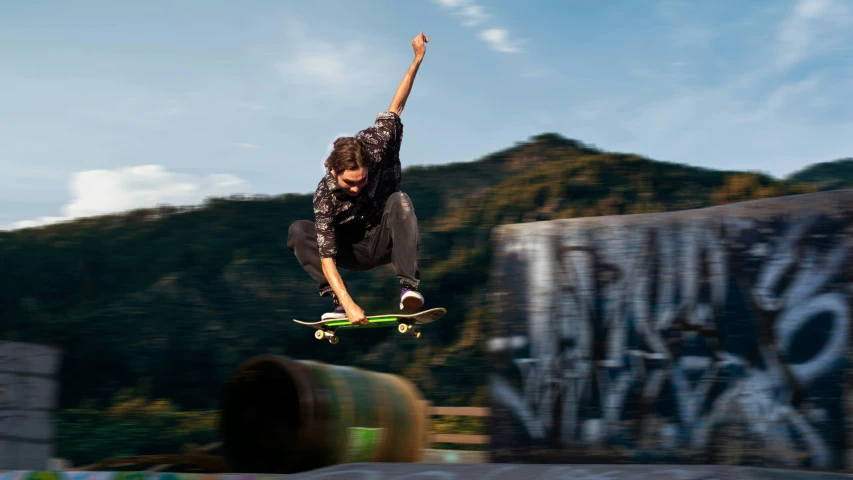 a  jumping off his skateboard in the air