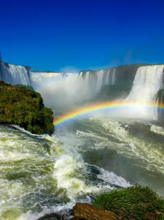 the waterfall has a rainbow on it