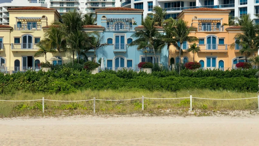 a white and blue boat in front of some buildings