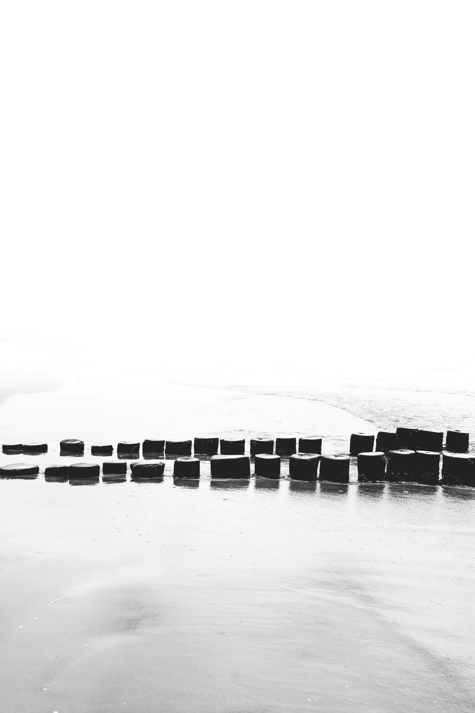 a large expanse of water filled with lots of white sand