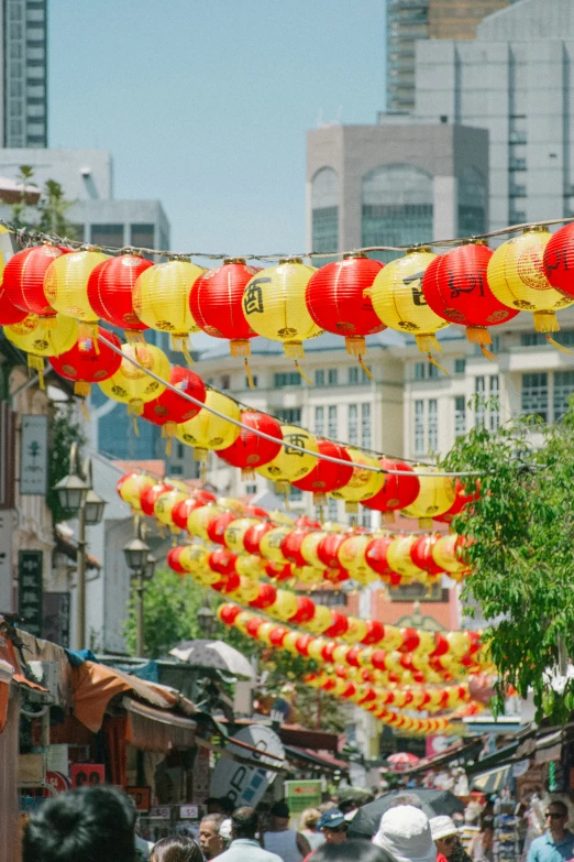 many red and yellow lanterns hanging from a string