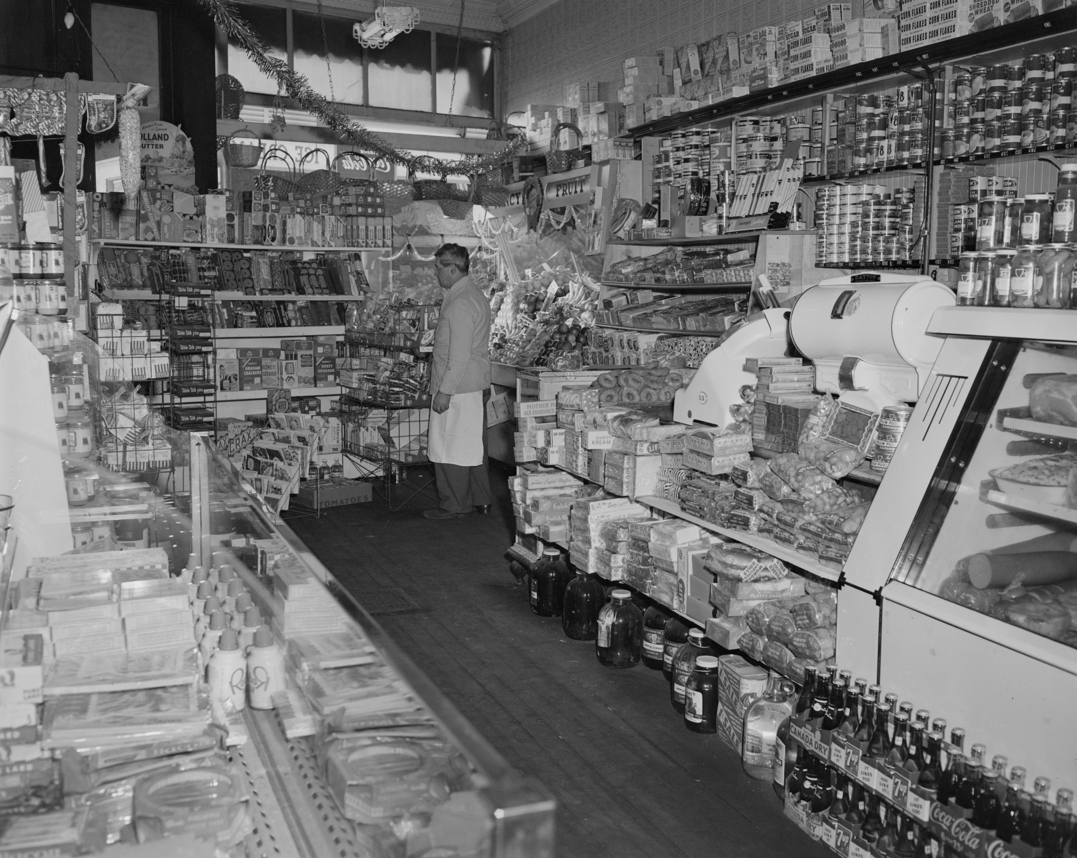 the inside of a grocery store with shelves full of food