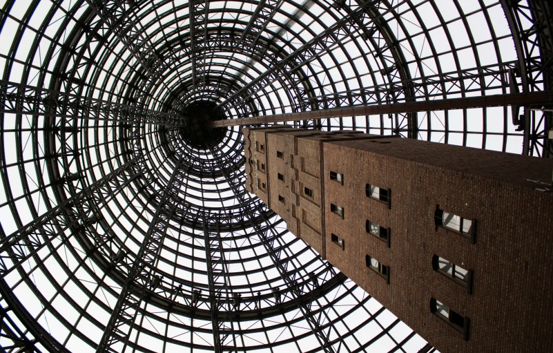 an atrium with a skylight and a building with glass