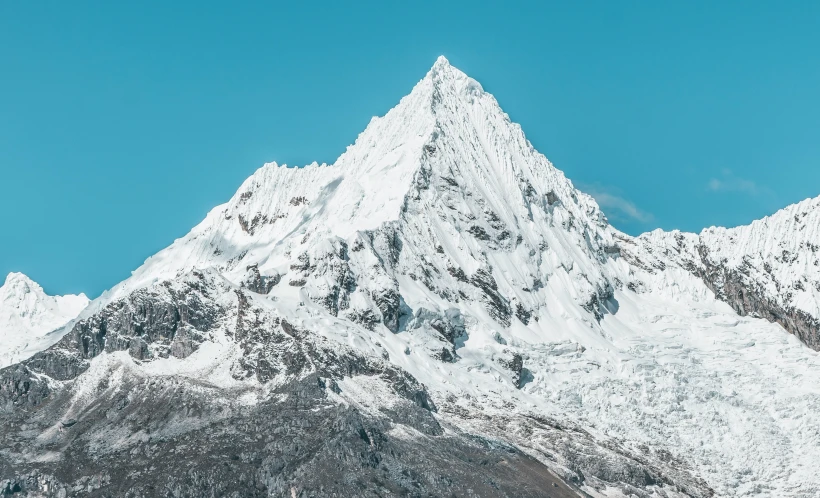 two skiers are skiing in the snow against the background of a mountain