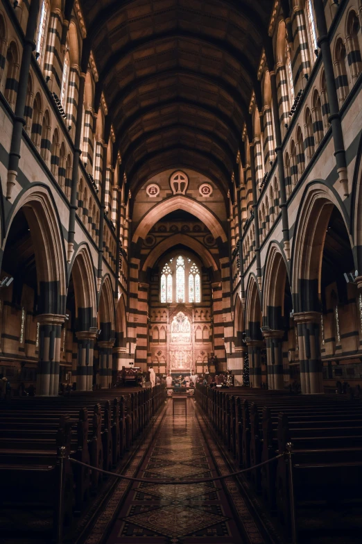 a large building filled with lots of pews