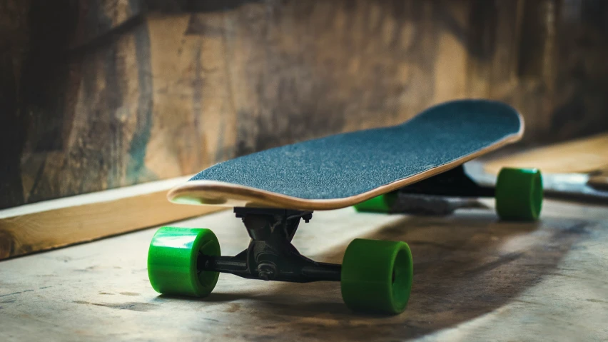 a close up of a skateboard sitting on the floor
